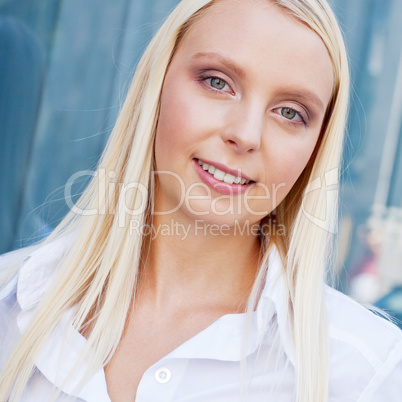 attractive young successful smiling business woman standing outdoor