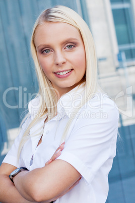 attractive young successful smiling business woman standing outdoor