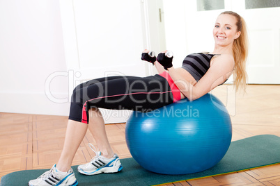 attractive young woman doing fitness dumbbell