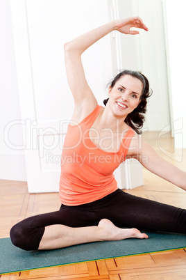 young attractive woman doing pilates