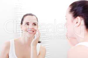 apllying cream on face skincare