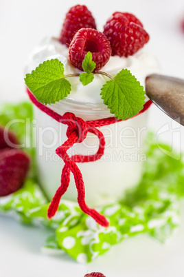 Raspberries and yoghurt or clotted cream