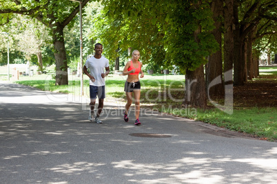 young couple runner jogger in park outdoor summer