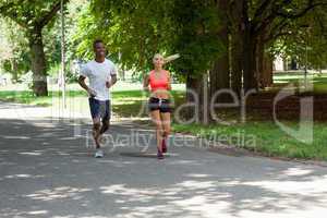 young couple runner jogger in park outdoor summer