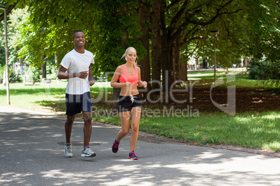 young couple runner jogger in park outdoor summer