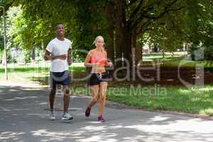 young couple runner jogger in park outdoor summer