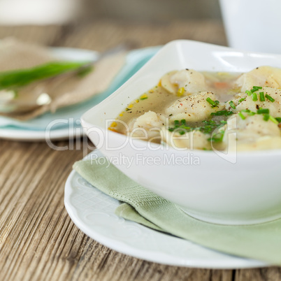 Dish of savory pork tortellini in broth pelmeni russian