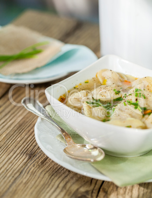Dish of savory pork tortellini in broth pelmeni russian