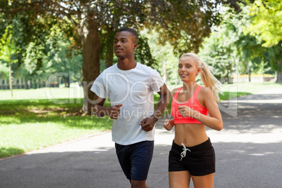 young couple runner jogger in park outdoor summer