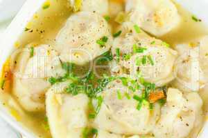 Dish of savory pork tortellini in broth pelmeni russian