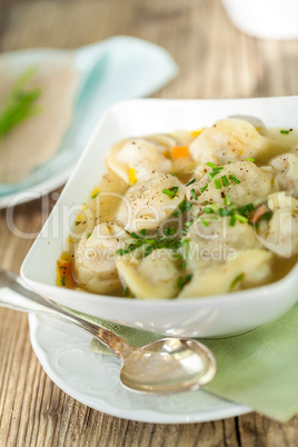 Dish of savory pork tortellini in broth pelmeni russian