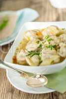 Dish of savory pork tortellini in broth pelmeni russian