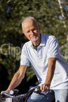 Senior Man Riding Bicycle