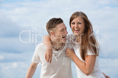 smiling young couple having fun in summer holiday