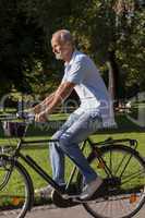 Senior Man Riding Bicycle