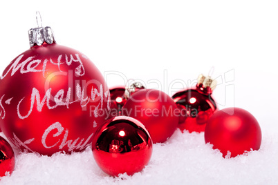 christmas decoration festive red bauble in snow isolated