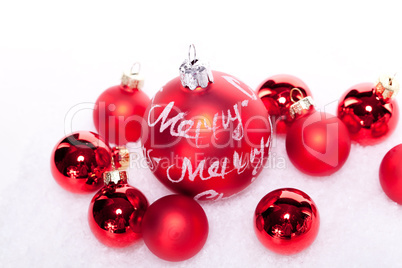 christmas decoration festive red bauble in snow isolated