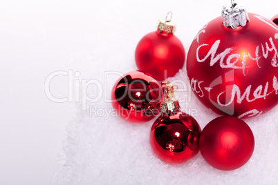 christmas decoration festive red bauble in snow isolated