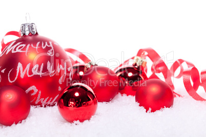 christmas decoration festive red bauble in snow isolated