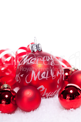 christmas decoration festive red bauble in snow isolated