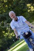 Senior Man Riding Bicycle