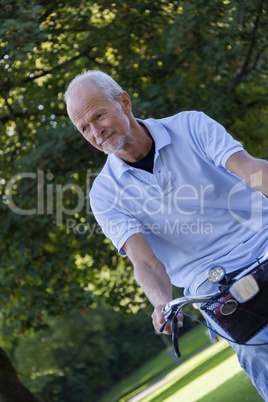 Senior Man Riding Bicycle