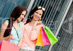 two attractive young girls women on shopping tour