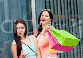 two attractive young girls women on shopping tour