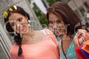 two attractive young girls women on shopping tour