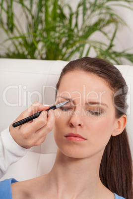 young attractive woman makeup eyebrow powder shadow applying