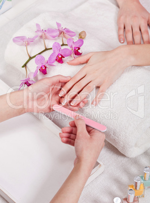 manicure making in beauty spa salon