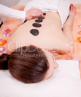 young attractive woman get hot stone massage