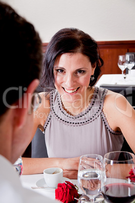 happy smiling couple in restaurant