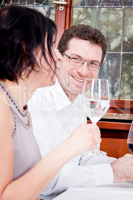 smiling happy people in restaurant