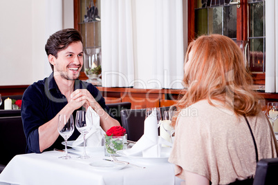 happy smiling couple in restaurant