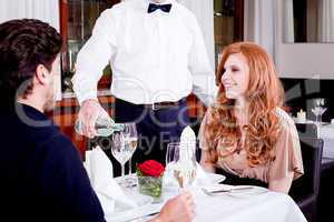 man and woman for dinner in restaurant