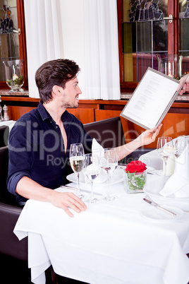 man and woman in restaurant for dinner