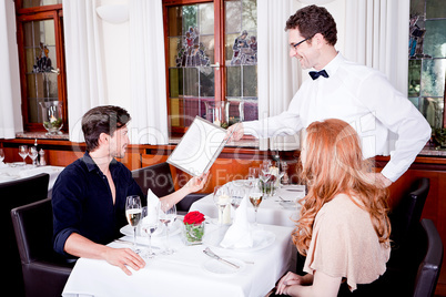 man and woman in restaurant for dinner