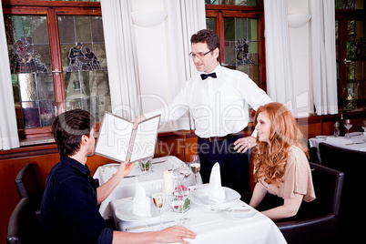 man and woman in restaurant for dinner