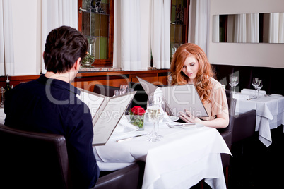 man and woman in restaurant for dinner