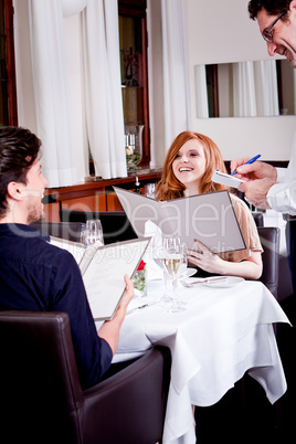 man and woman in restaurant for dinner