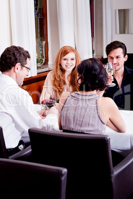 smiling happy people in restaurant