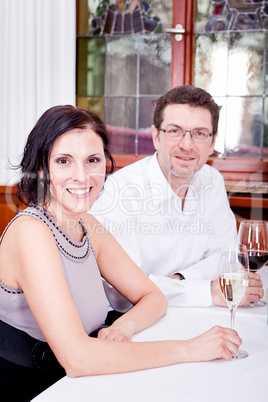 smiling happy people in restaurant