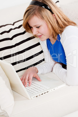 young teenager girl with laptop smilig