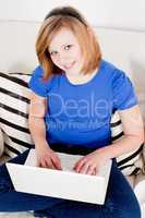 young teenager girl with laptop smilig