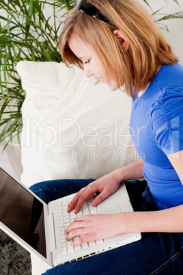 young teenager girl with laptop smilig