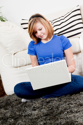 young teenager girl with laptop smilig