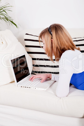 young teenager girl with laptop smilig