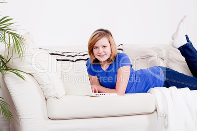 young teenager girl with laptop smilig