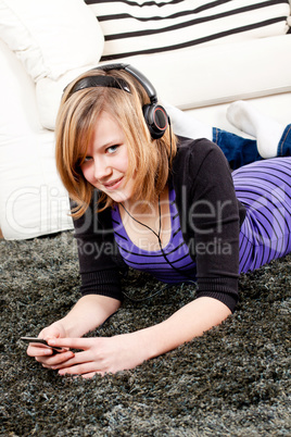 happy teenager girl listening to music